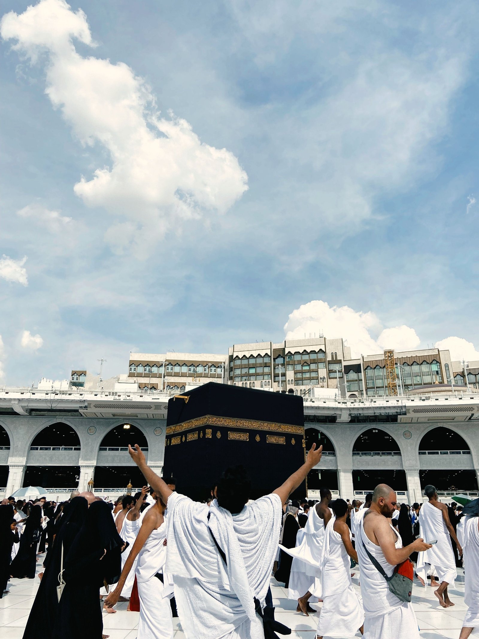 A breathtaking high-fidelity golden hour image of the vast courtyard around the Kaaba in Mecca.